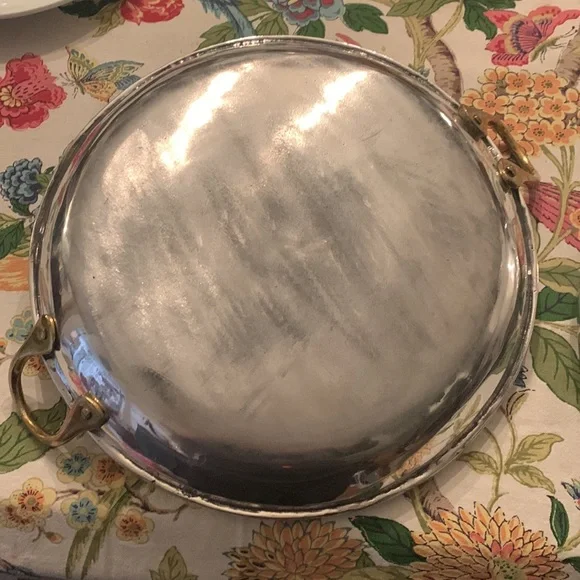 Stainless steel? Brass handle huge trays? Skillets? Made in Mexico